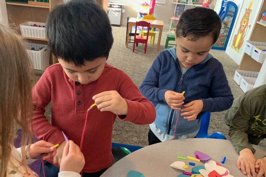 children working on arts and crafts at Yellow Brick Road Preschool in Napa