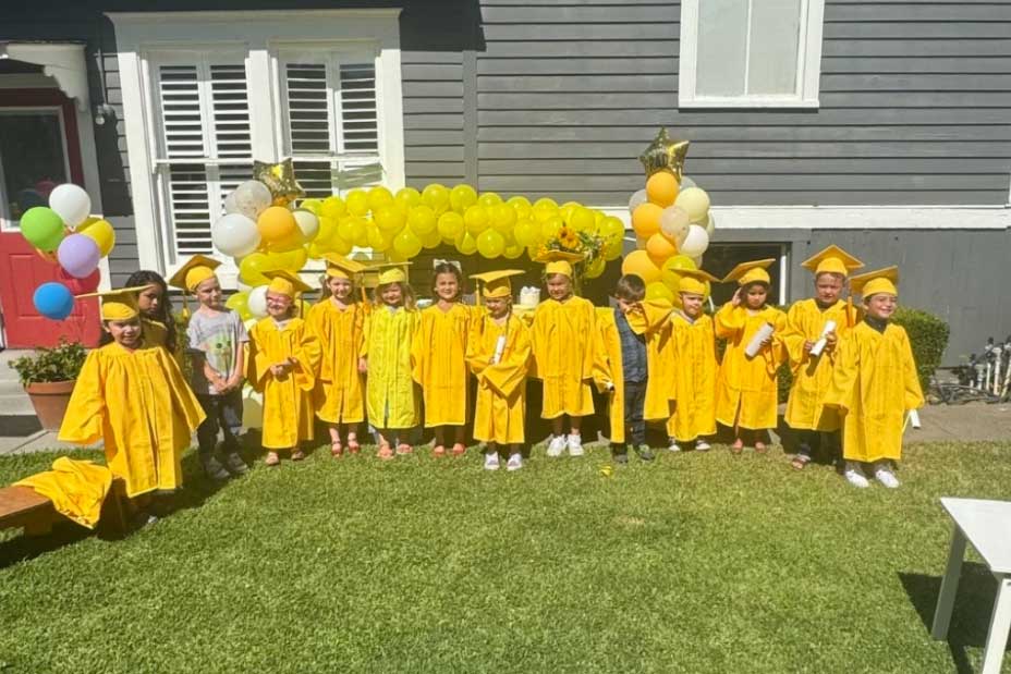 graduates in yellow caps and gowns at Yellow Brick Road Preschool in Napa