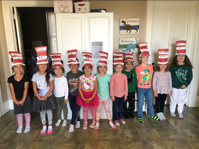 group of preschool children wearing homemade Cat in the Hat hats